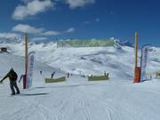 Large area with slopes for slower skiers at the mountain station of the 3 person L'Olympique cable car (Val d´Isère)