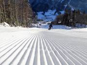 Freshly groomed slope in the ski resort of Loser