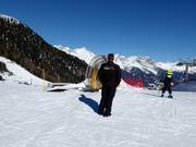 The friendly staff is also present at the conveyor belt.