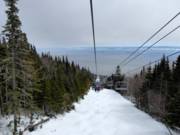 Chairlift with a view of the Saint Lawrence River in the ski resort of Le Massif